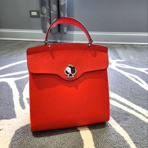 Kate Spade New York : Genuine Leather Orange purse/backpack.